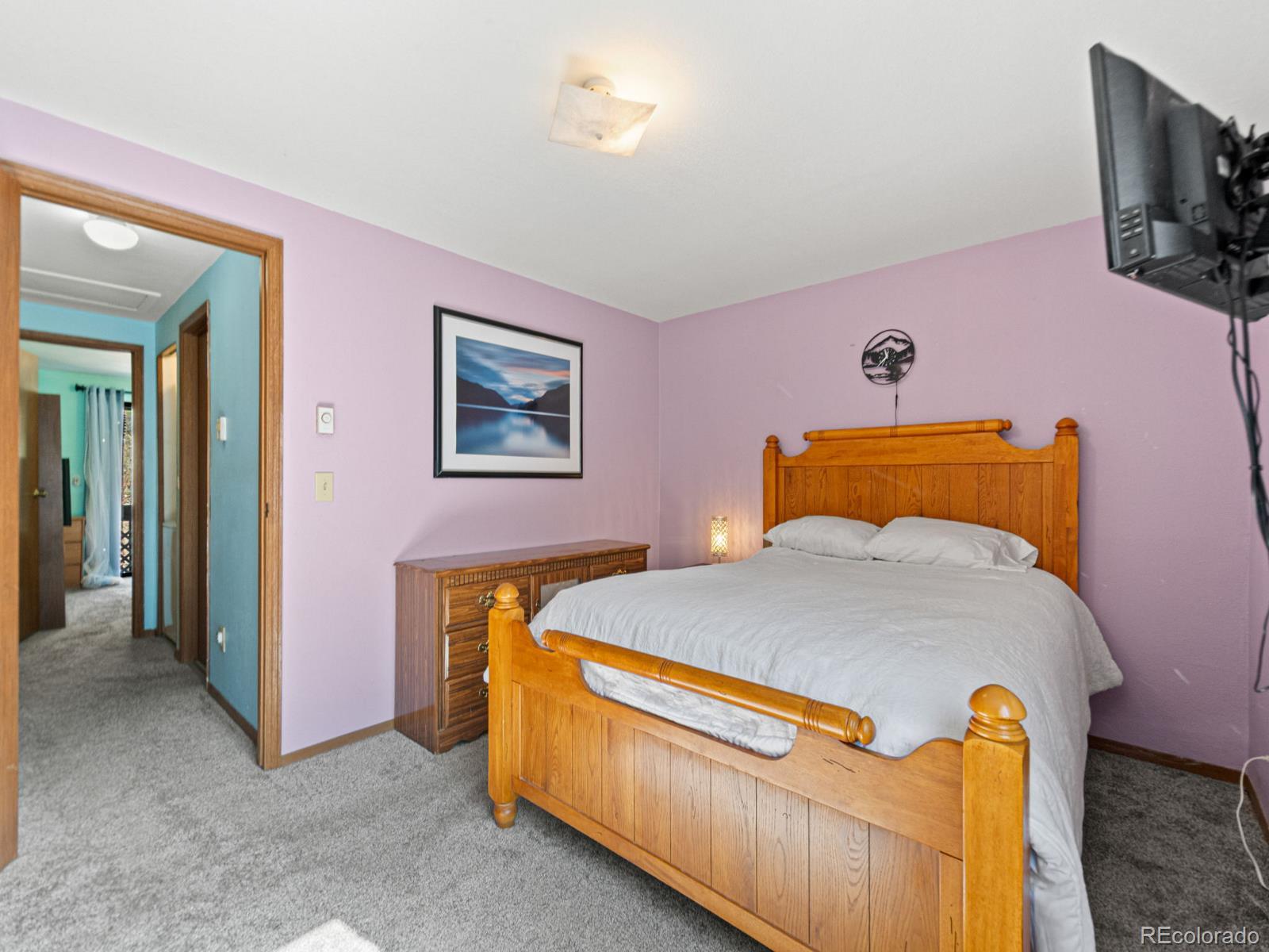 3301 Riverside Drive Idaho Springs, CO 80452 - Photo 12 of 35 a bedroom with bed and tv