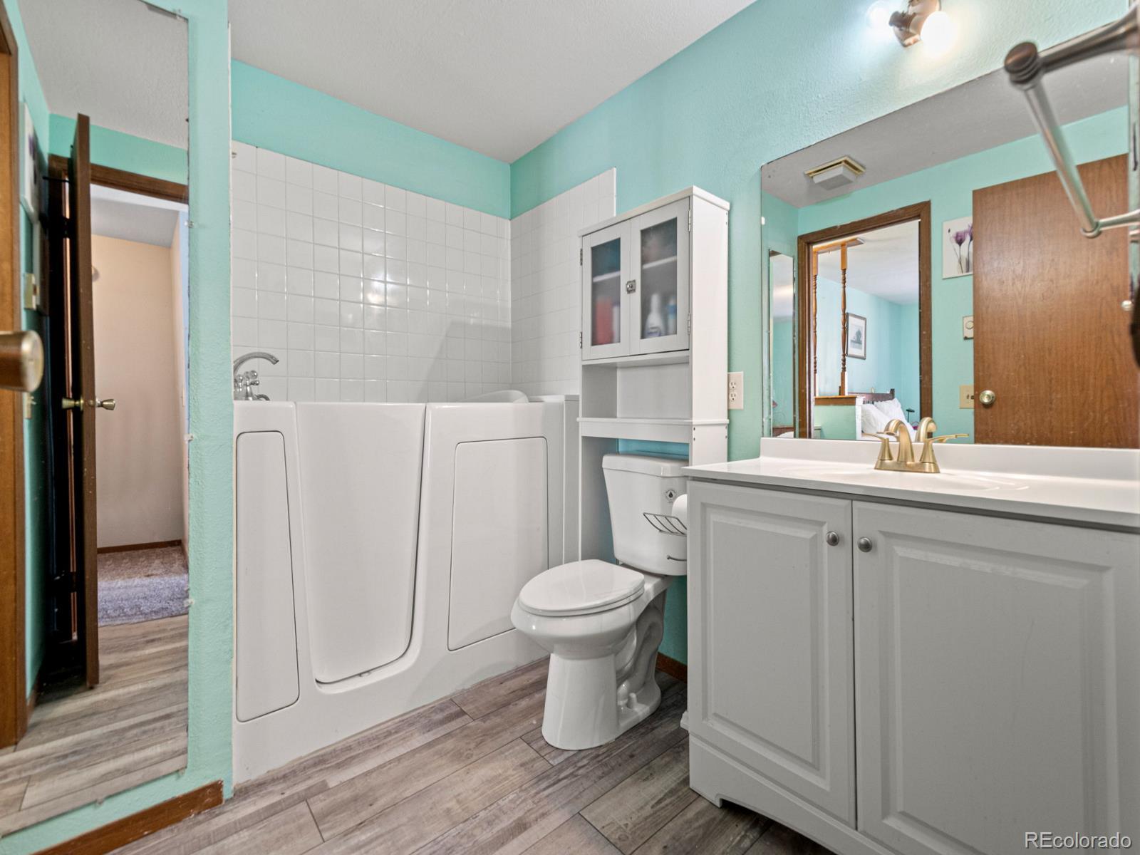 3301 Riverside Drive Idaho Springs, CO 80452 - Photo 18 of 35 a bathroom with a sink toilet and a shower