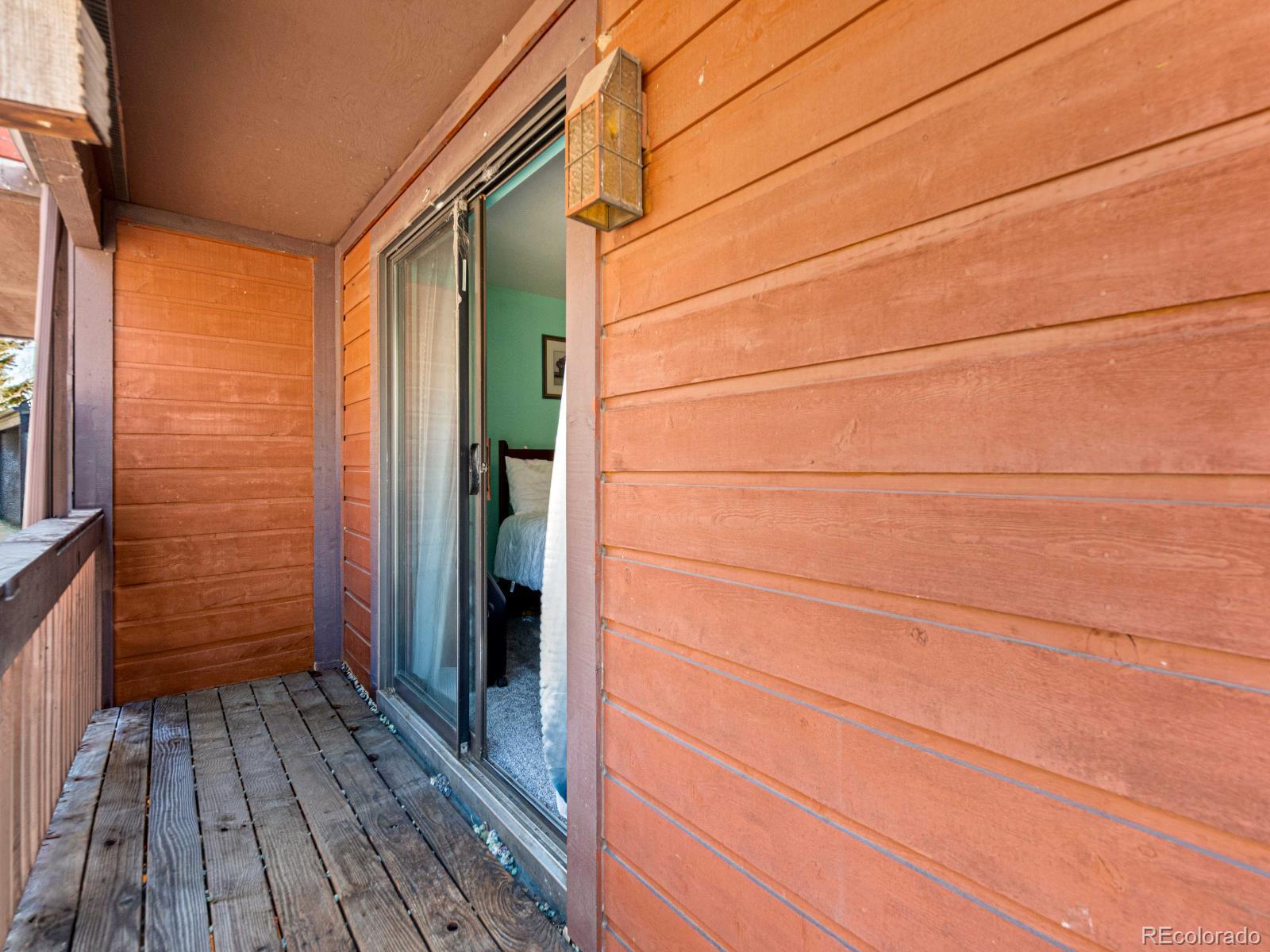 3301 Riverside Drive Idaho Springs, CO 80452 - Photo 20 of 35 a view of a house with a door and wooden floor