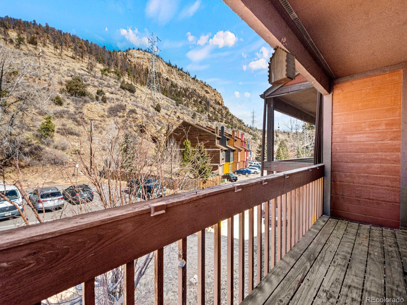 3301 Riverside Drive Idaho Springs, CO 80452 - Photo 21 of 35 a view of a balcony with wooden floor