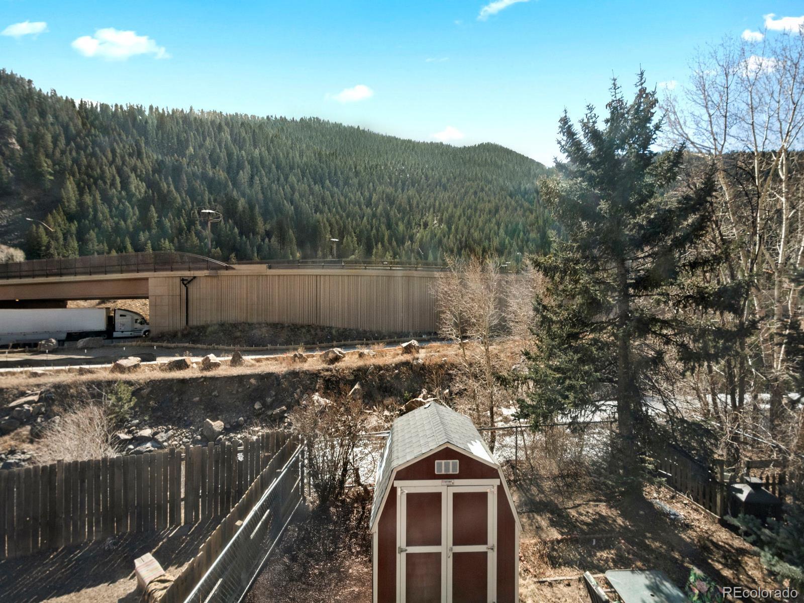 3301 Riverside Drive Idaho Springs, CO 80452 - Photo 23 of 35 a view of a house with a yard