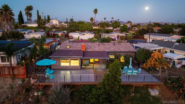a view of a swimming pool with outdoor seating