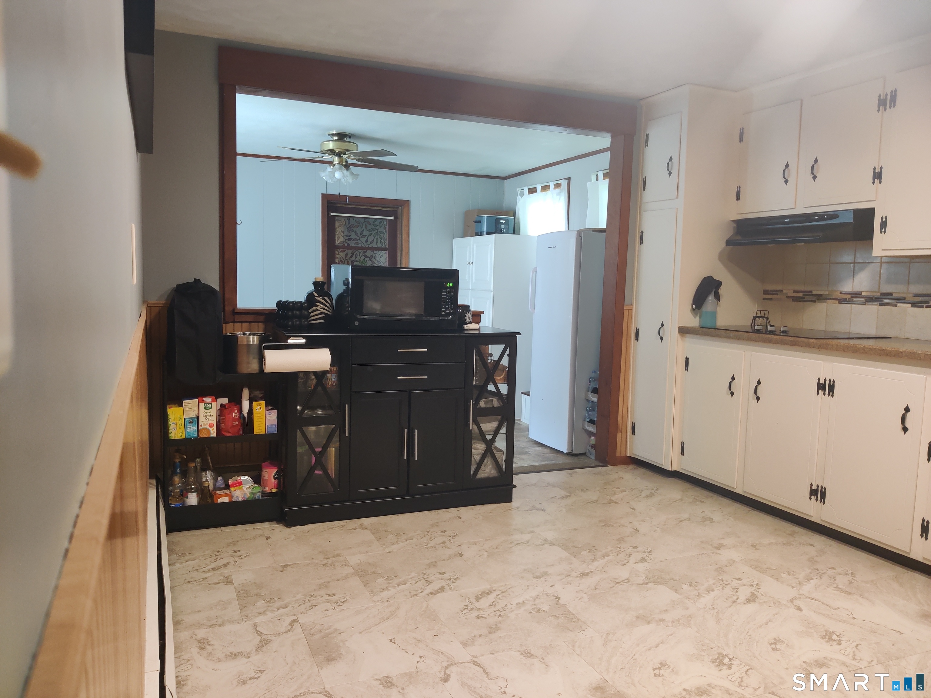 35 Brook Road Enfield, CT 06082 - Photo 5 of 25 a kitchen with granite countertop a refrigerator and a stove top oven