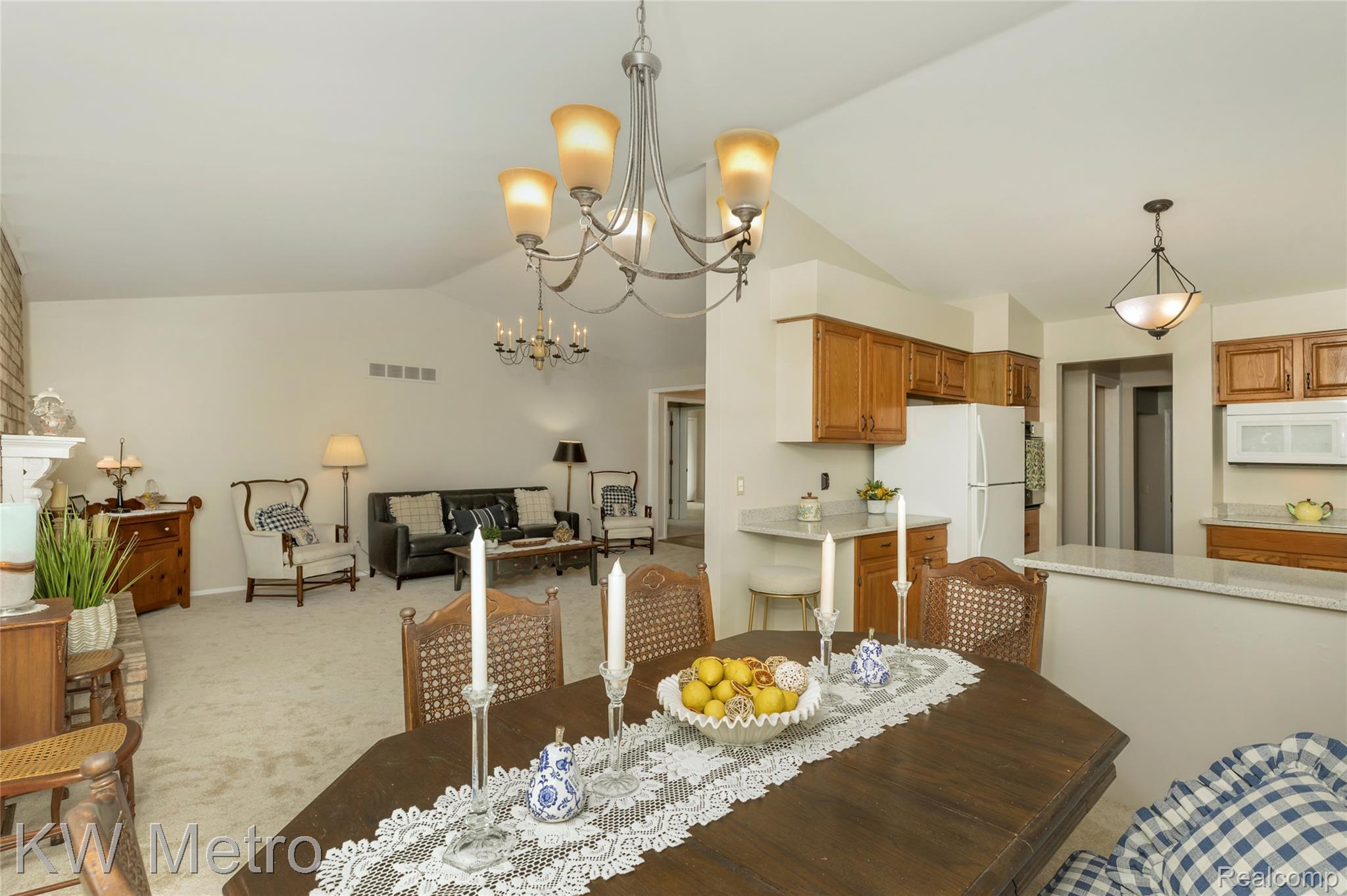 2154 Warrington Road Rochester, MI 48307 - Photo 14 of 41 Vaulted ceiling dining area with chandelier lighting