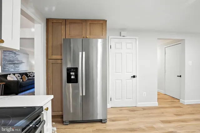 a view of a kitchen with appliances and cabinets