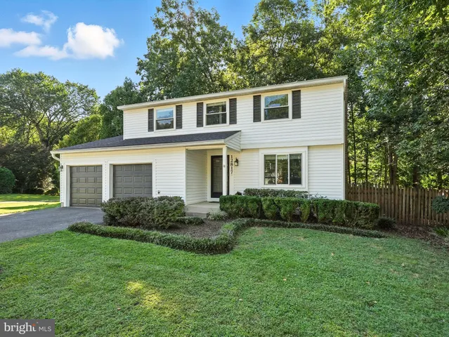 a picture of a room with a white wall and white cabinet