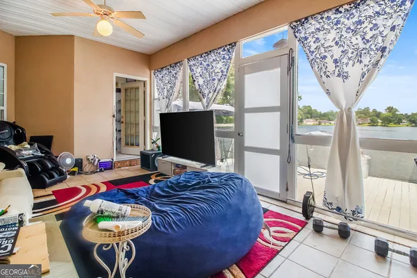 a bedroom with bed and wooden floor