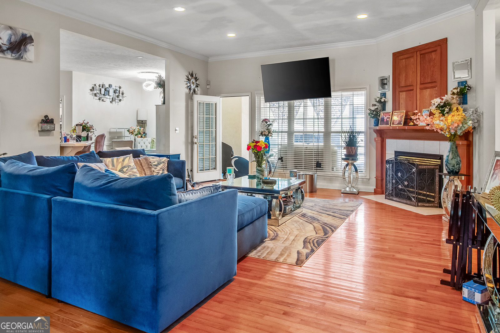 120 Timber Ridge Drive Thomasville, GA 31757 - Photo 7 of 23 a living room with furniture a flat screen tv and a fireplace