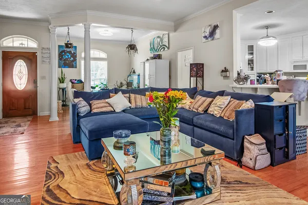 a living room with furniture and a window