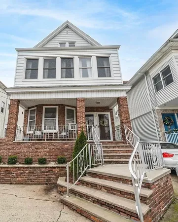 front view of a house with a balcony