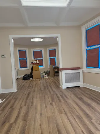 a view of a livingroom with furniture and wooden floor