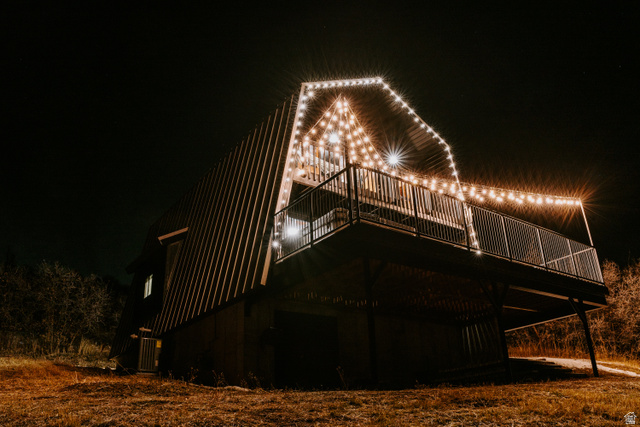 1413 Basel Drive Midway, UT 84049 - Photo 117 of 137 Back of house at night featuring a deck