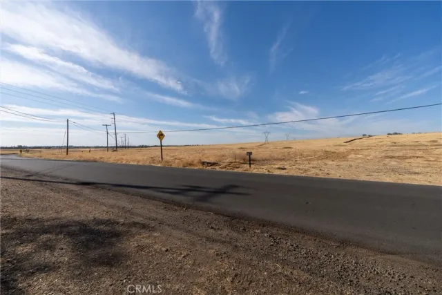 a view of yard with wooden fence