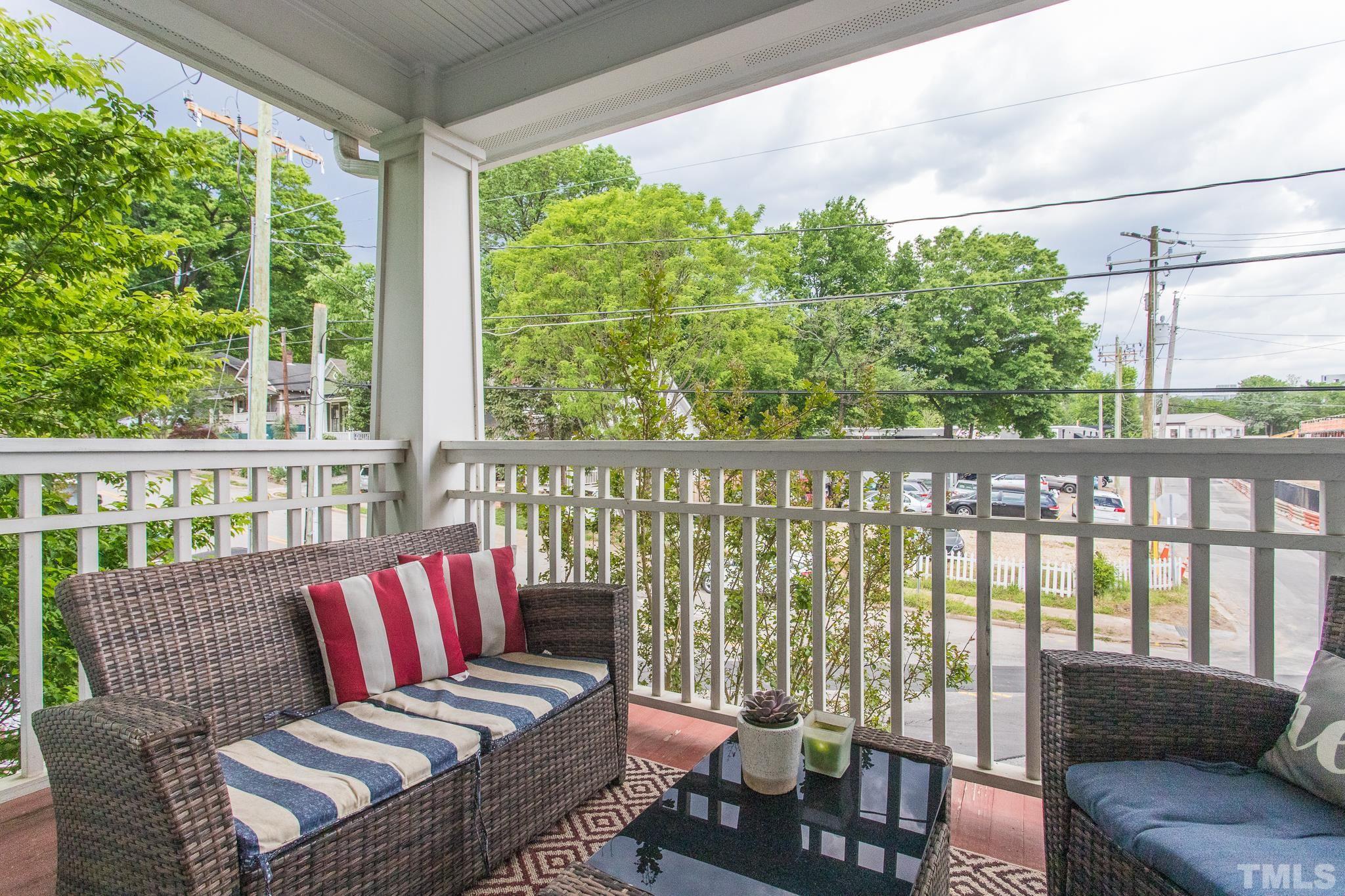 613 West Cabarrus Street, Unit 202 Raleigh, NC 27603 - Photo 14 of 25 a balcony with furniture and a potted plant