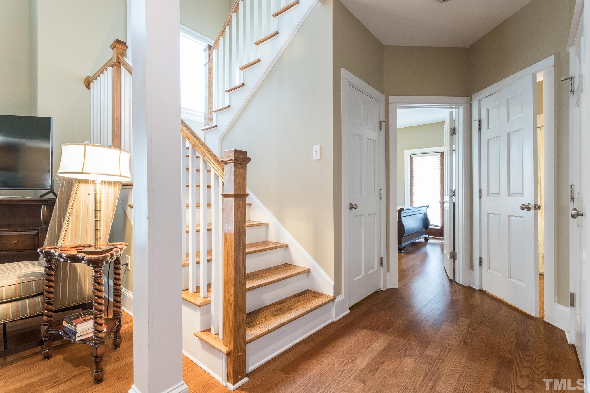 613 West Cabarrus Street, Unit 202 Raleigh, NC 27603 - Photo 15 of 25 a view of a hallway with wooden floor and staircase