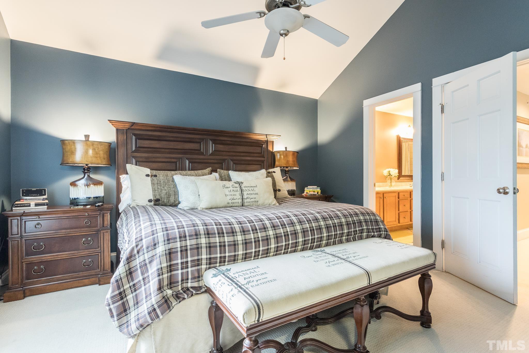 613 West Cabarrus Street, Unit 202 Raleigh, NC 27603 - Photo 17 of 25 a bedroom with a bed and a table in it