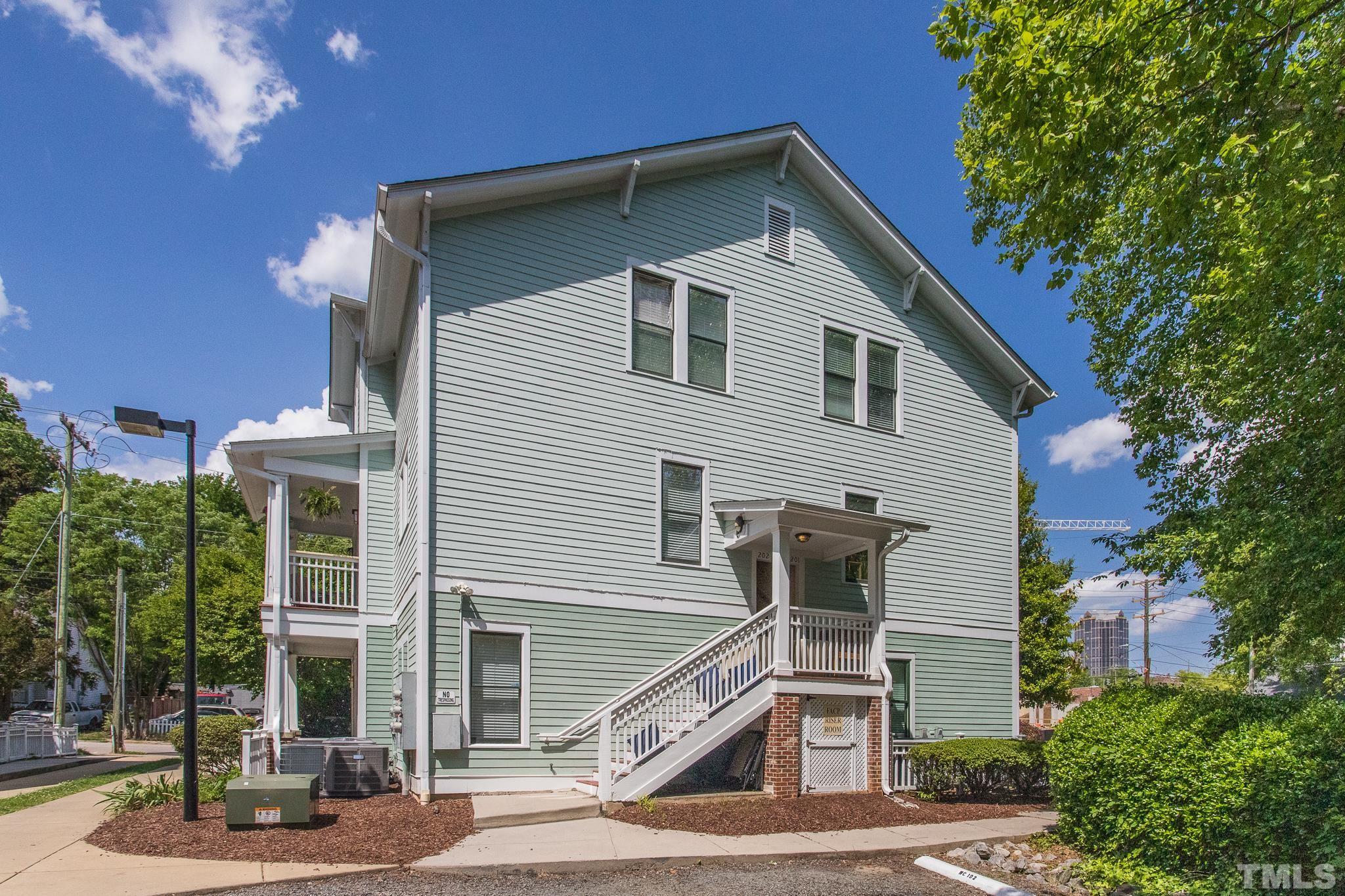 613 West Cabarrus Street, Unit 202 Raleigh, NC 27603 - Photo 25 of 25 a view of a house with a yard