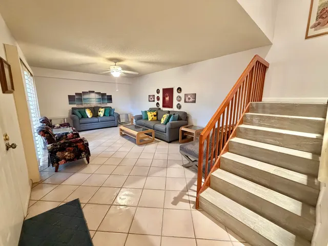 a room with lots of chairs and mirrors