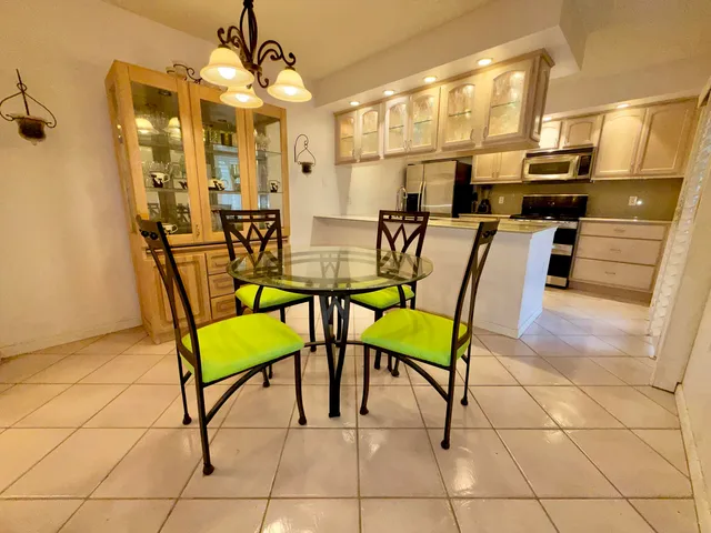 a kitchen with stainless steel appliances granite countertop a stove and a refrigerator