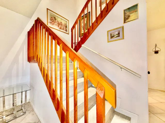 a bedroom with two beds and a window