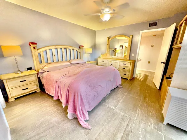 a bathroom with a sink mirror vanity and toilet