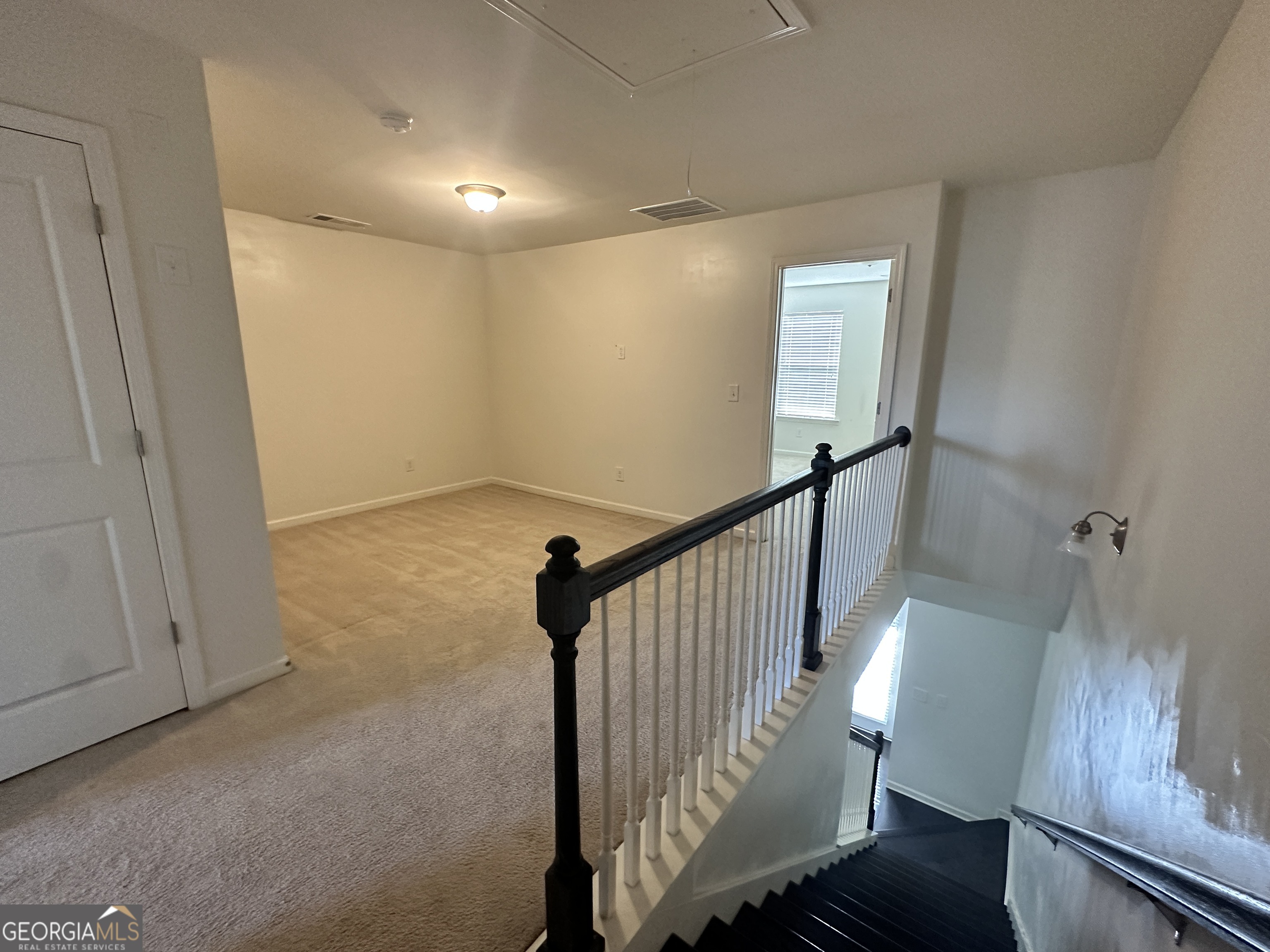 882 Ambient Way Atlanta, GA 30331 - Photo 11 of 61 a view of a hallway with wooden floor and staircase