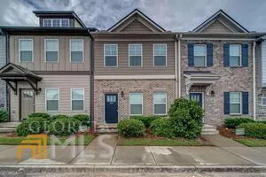 a kitchen with stainless steel appliances granite countertop a stove microwave refrigerator and sink