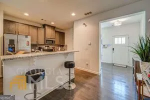 a living room with furniture and a ceiling fan