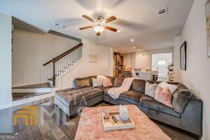 882 Ambient Way Atlanta, GA 30331 - Photo 25 of 61 a living room with furniture and a chandelier