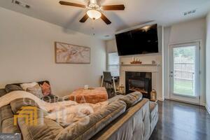 882 Ambient Way Atlanta, GA 30331 - Photo 28 of 61 a bed room with a bed tv and a fireplace