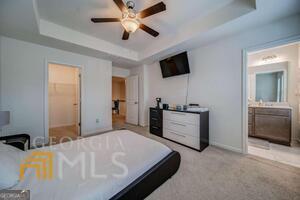 882 Ambient Way Atlanta, GA 30331 - Photo 31 of 61 a bedroom with a bed and a flat screen tv