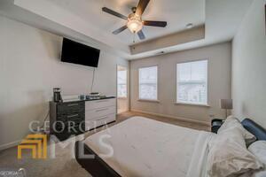 882 Ambient Way Atlanta, GA 30331 - Photo 32 of 61 a bedroom with a bed and a flat screen tv