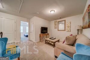 882 Ambient Way Atlanta, GA 30331 - Photo 34 of 61 a living room with furniture and a flat screen tv