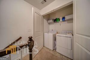882 Ambient Way Atlanta, GA 30331 - Photo 35 of 61 a view of storage and utility room with washer and dryer