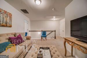 882 Ambient Way Atlanta, GA 30331 - Photo 37 of 61 a living room with furniture and a flat screen tv