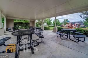 882 Ambient Way Atlanta, GA 30331 - Photo 43 of 61 a view of a patio with table and chairs potted plants with wooden floor