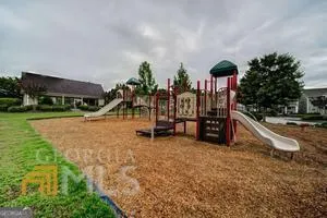 a kitchen with stainless steel appliances a refrigerator sink and microwave