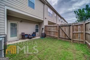 882 Ambient Way Atlanta, GA 30331 - Photo 47 of 61 a view of a house with a yard and sitting area