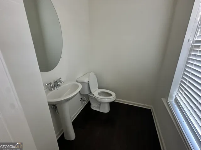 a bathroom with a sink and glass door shower