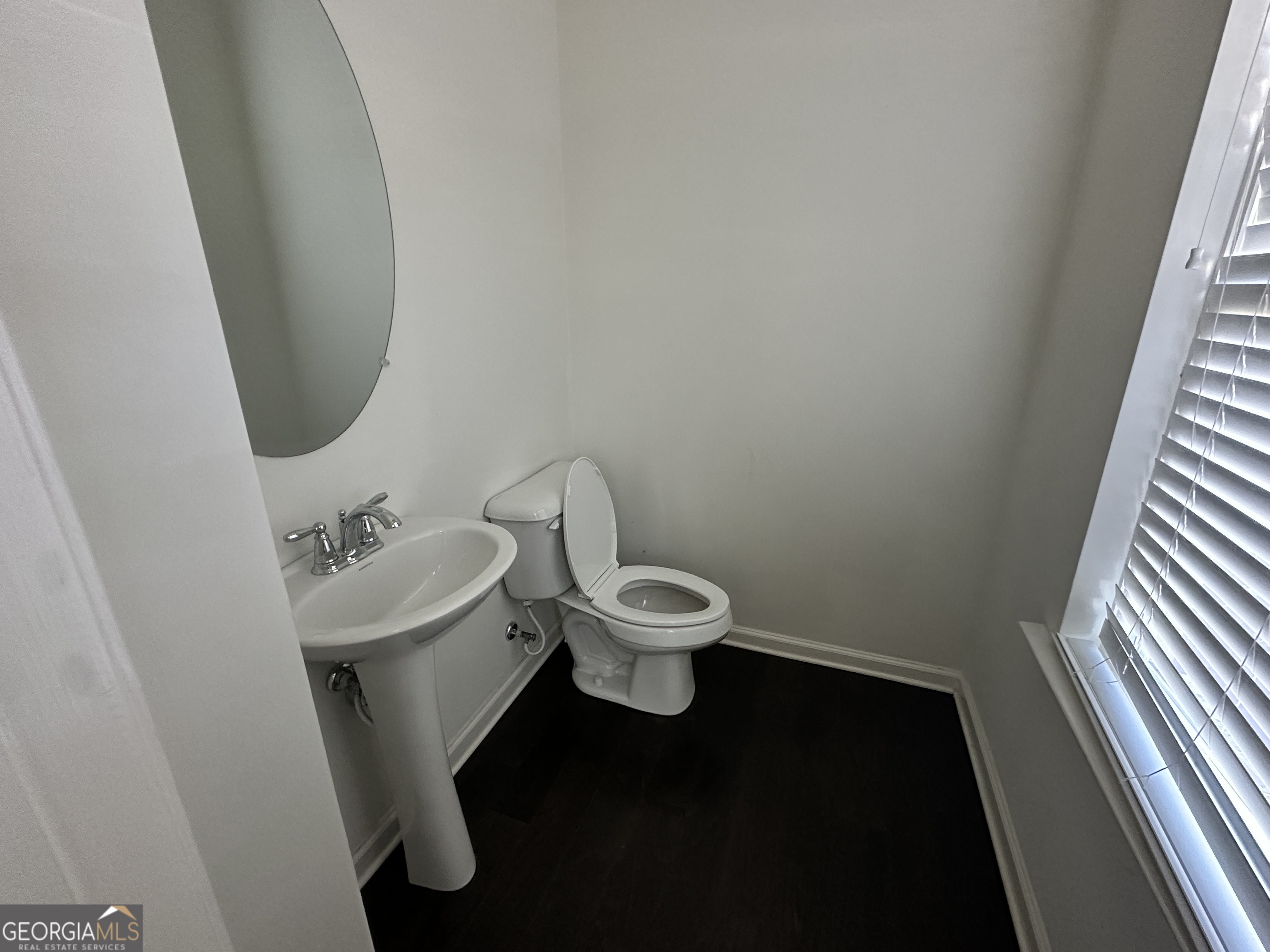882 Ambient Way Atlanta, GA 30331 - Photo 50 of 61 a bathroom with a sink and a toilet