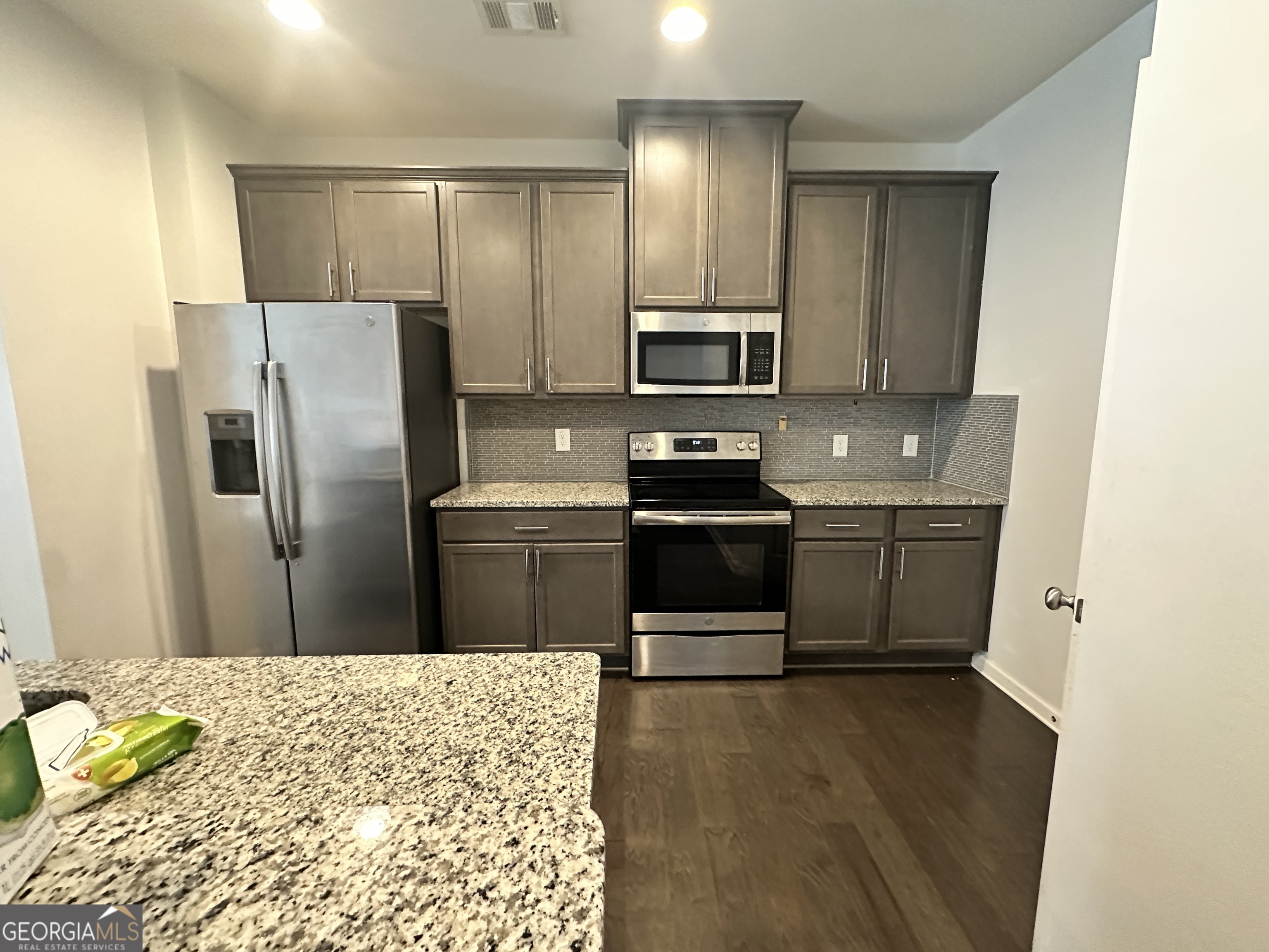 882 Ambient Way Atlanta, GA 30331 - Photo 54 of 61 a kitchen with stainless steel appliances a refrigerator sink and microwave