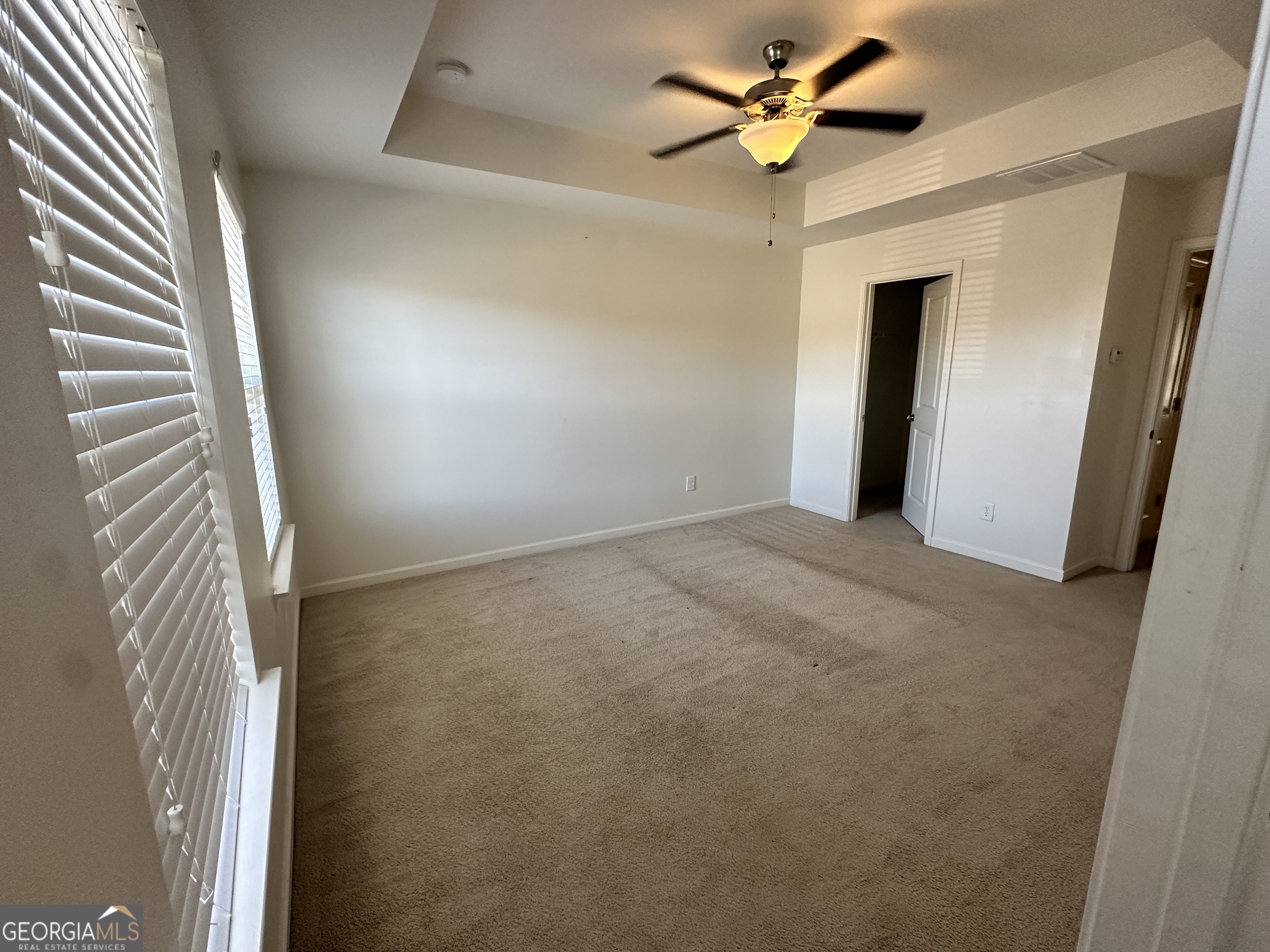 882 Ambient Way Atlanta, GA 30331 - Photo 9 of 61 an empty room with closet and a chandelier fan