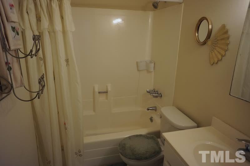 608 Dylan Court Raleigh, NC 27606 - Photo 7 of 12 This bathroom features an easy . maintenance shower/tub combo