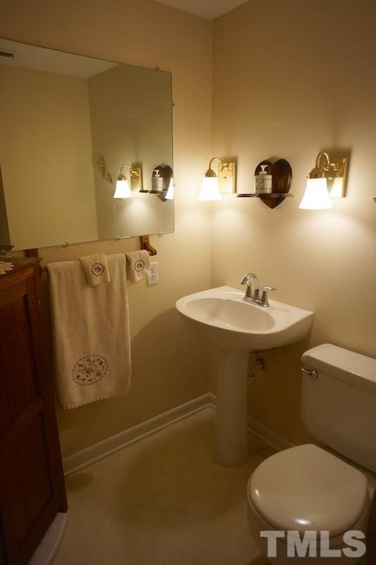 608 Dylan Court Raleigh, NC 27606 - Photo 8 of 12 Updated ,spacious half bath features pedestal sink