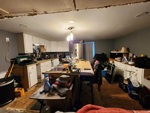 a bed room with a bed mirror and a flat screen tv
