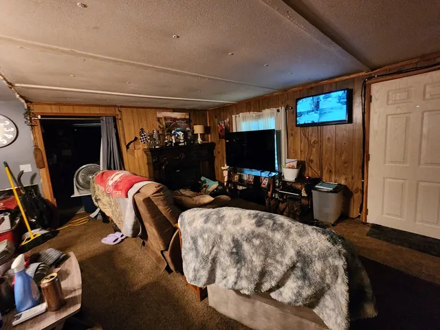 a bedroom with furniture and a window