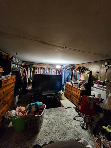 a view of a room with a bed