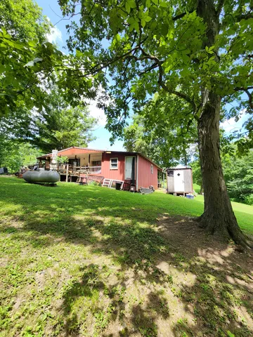 a view of a house with a big yard