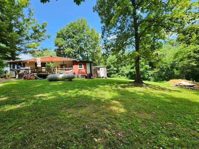 a view of an house with a garden