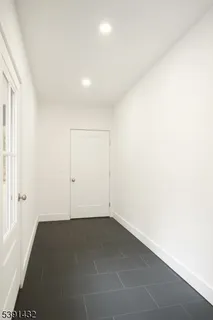 an empty room with a empty space and a window